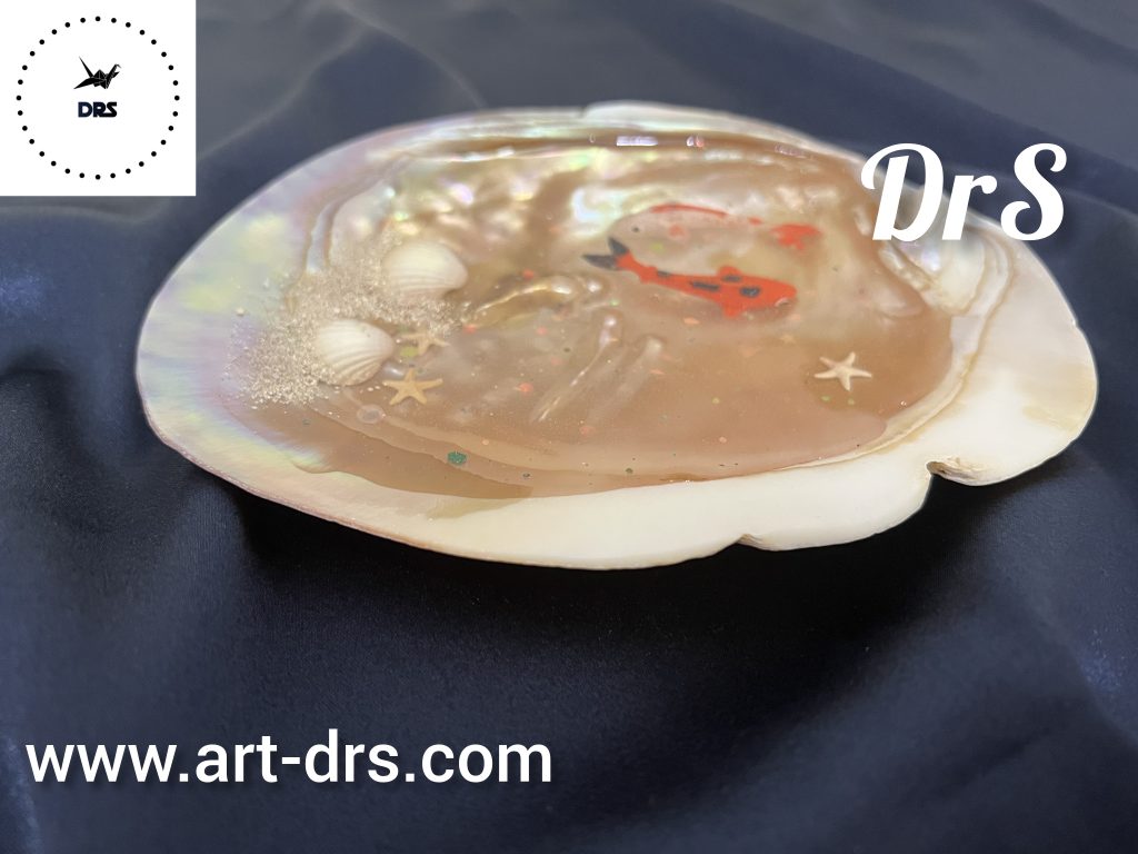 ماهی هفت سین در صدف کفه ای